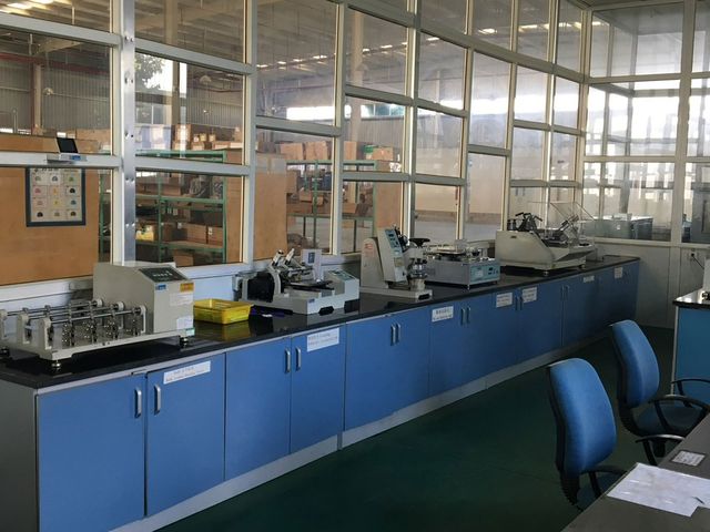 At one of our partner factories: a materials testing lab with benches and test equipment.